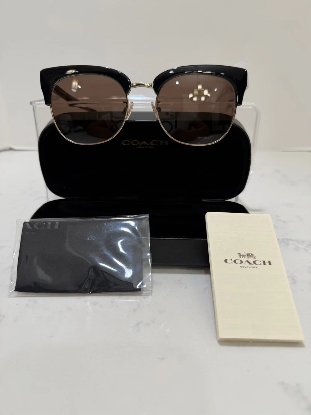 Coach Black Frame Sunglasses with Gold Trim and Brown Lenses